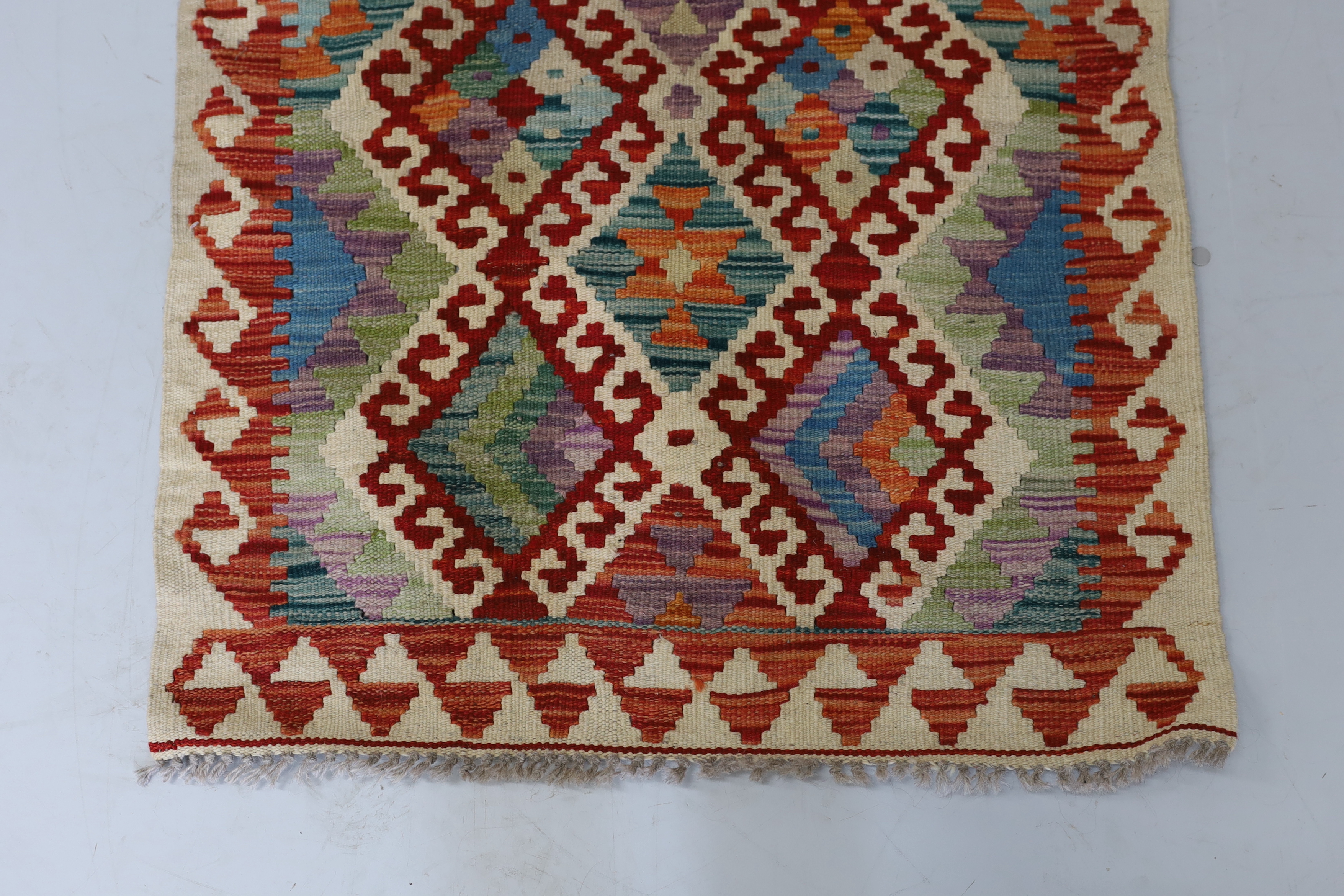 An Anatolian Kilim polychrome rug, 100 x 78cm